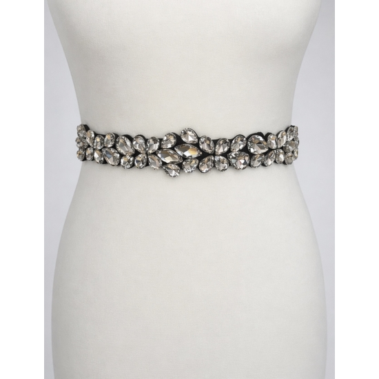 Elastyczny pasek z kryształową aplikacją – elegancki detal, który zmienia stylizację.